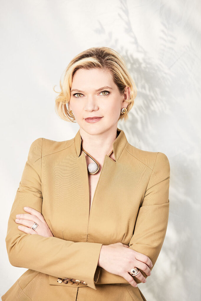Julia Steyn, CEO, in a professional portrait with arms crossed, captured by Visionary Headshots.
