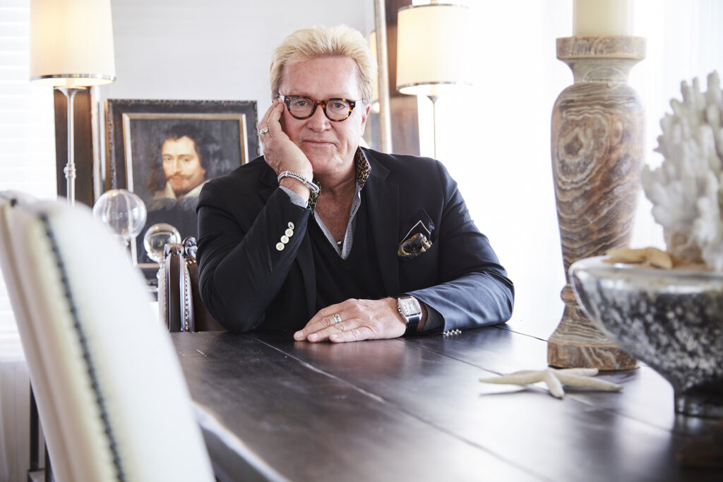 Mike Lahner, designer at Ethan Allen, seated at a table with a thoughtful expression, captured by Visionary Headshots.